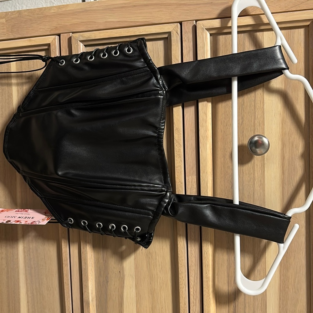 Black leather corset top. Brand new with tag.